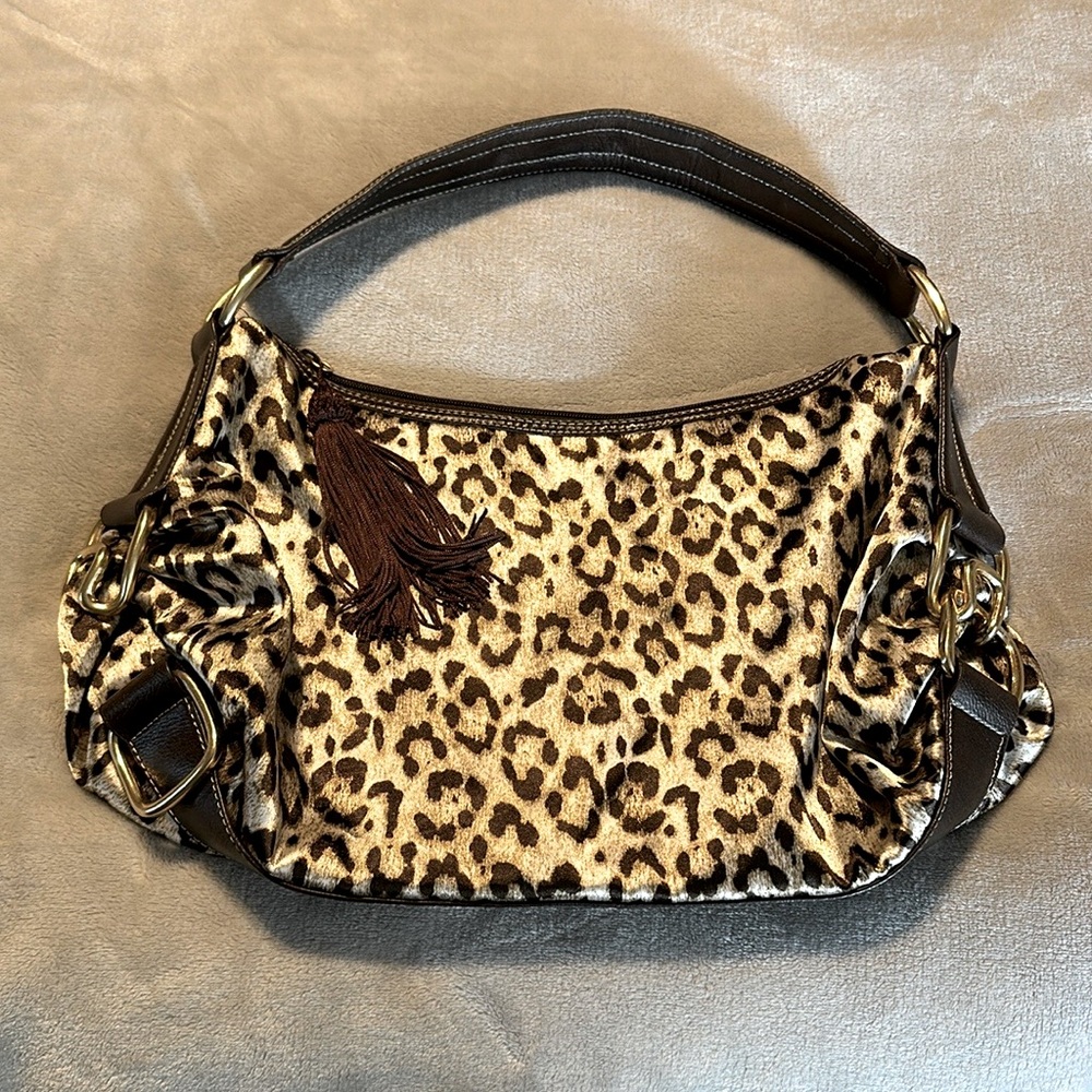 colin + colette. leopard print. zipper closure. satiny material inside & out.
